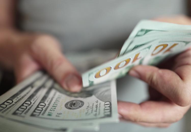 person holding cash