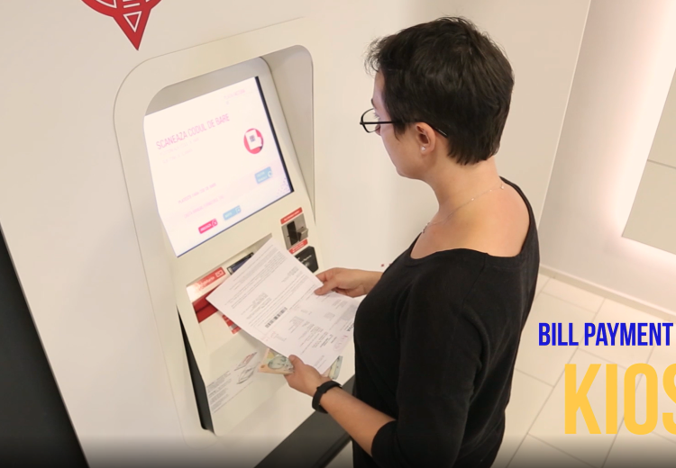 Person paying bill at self-service kiosk
