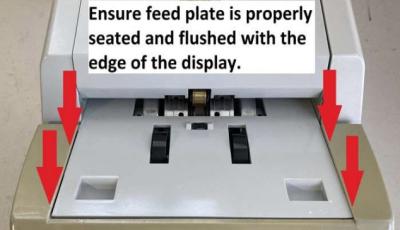 Ensure feed plate is properly seated and flush with the edge of the display